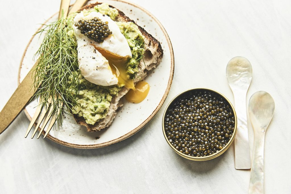 Avocado toast with poached egg and caviar